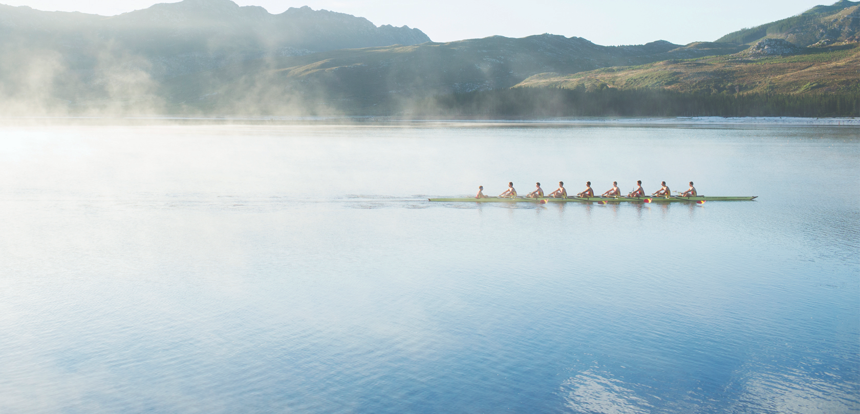 Rowing team on a lake