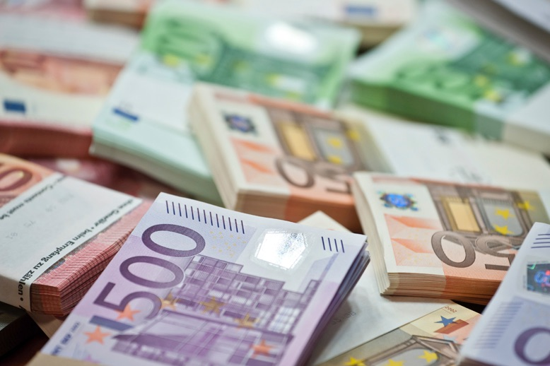 stacks of euro money bundles