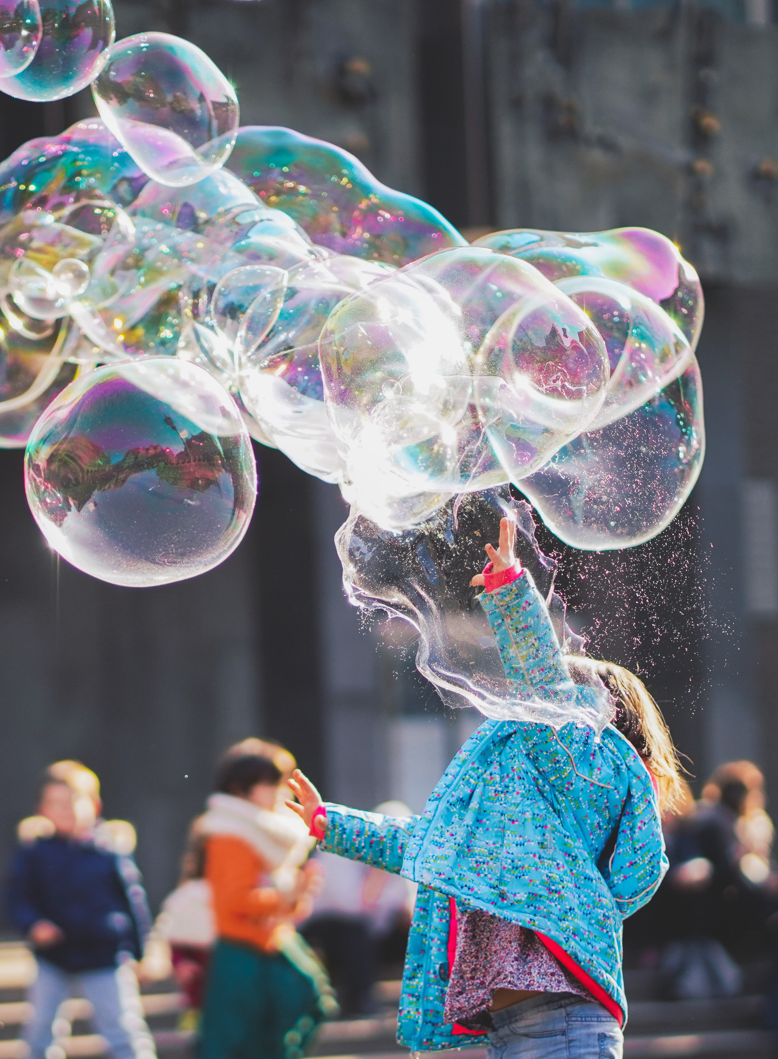 Child reaches for bubbles