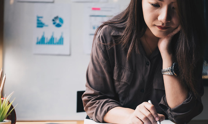female looking at her taxes in page