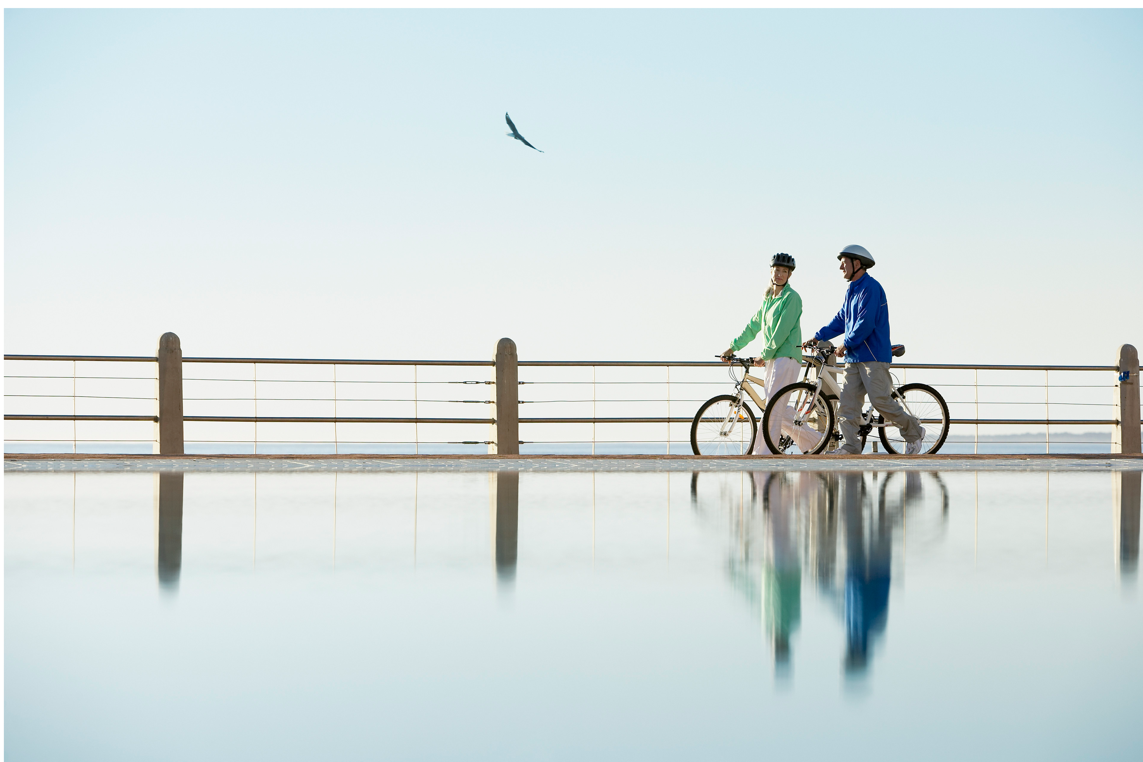 Man and woman riding bikes.