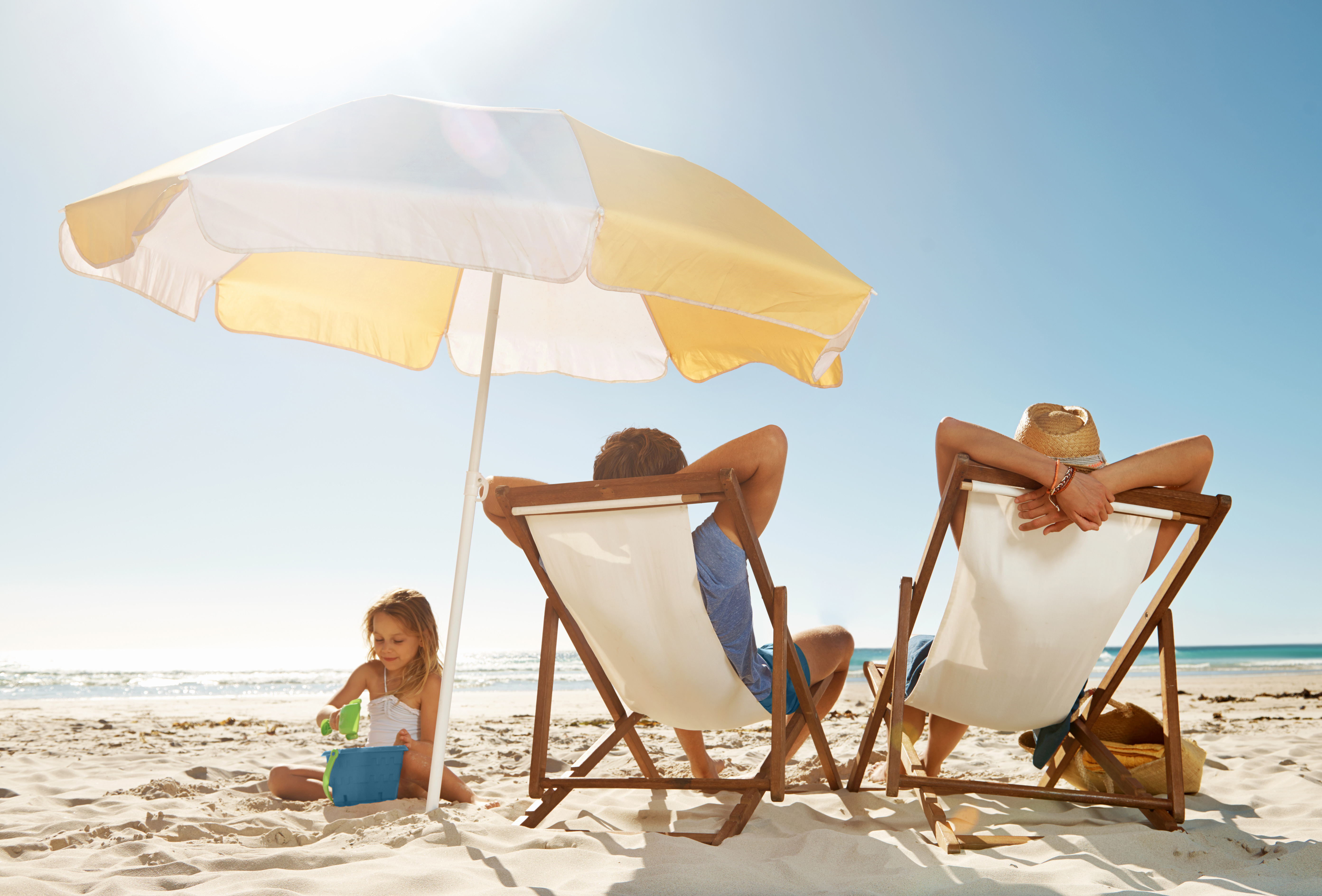 Family relaxing on beach