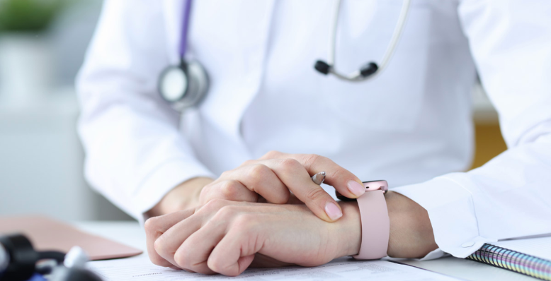 doctor sitting at office desk in page
