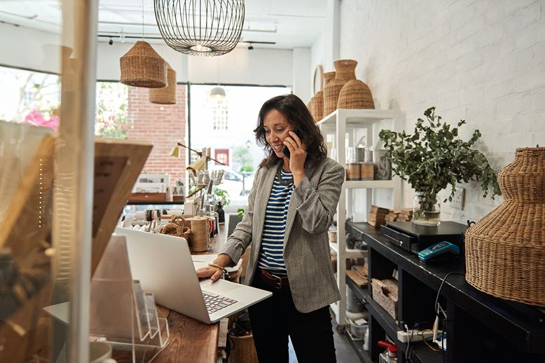 women working on laptop and phone in page