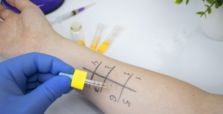 medical professional arm in page prepping for needle