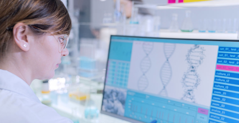 medical professional in page looking at computer of results