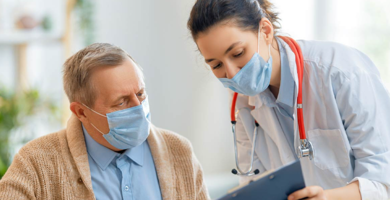 women doctor and man patient looking at document in page