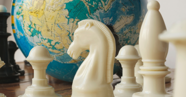 chess pieces and globe in page