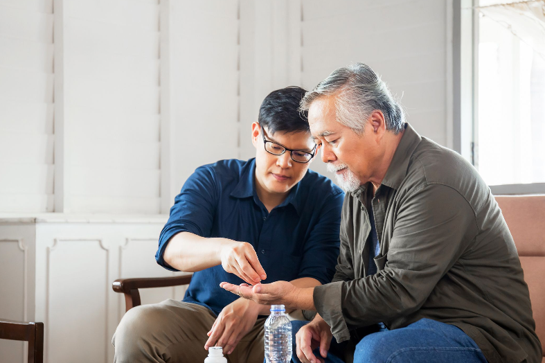 adult-son-caring-for-elderly-father