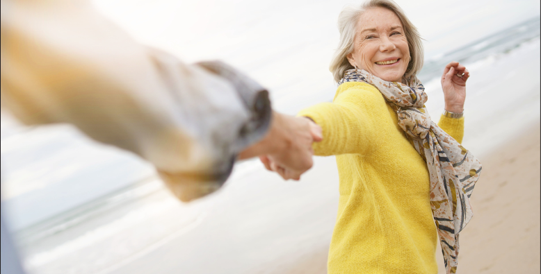woman holding hand and smiling