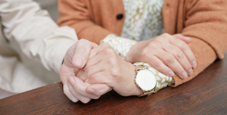 Seniors holding hands