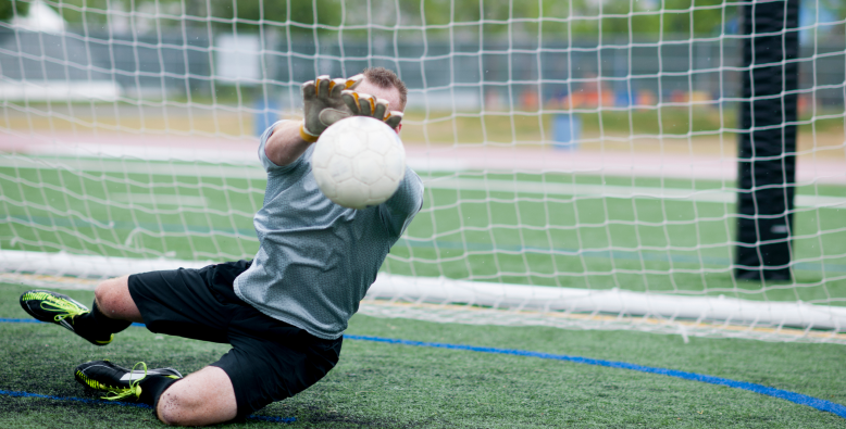 soccer goalie making save