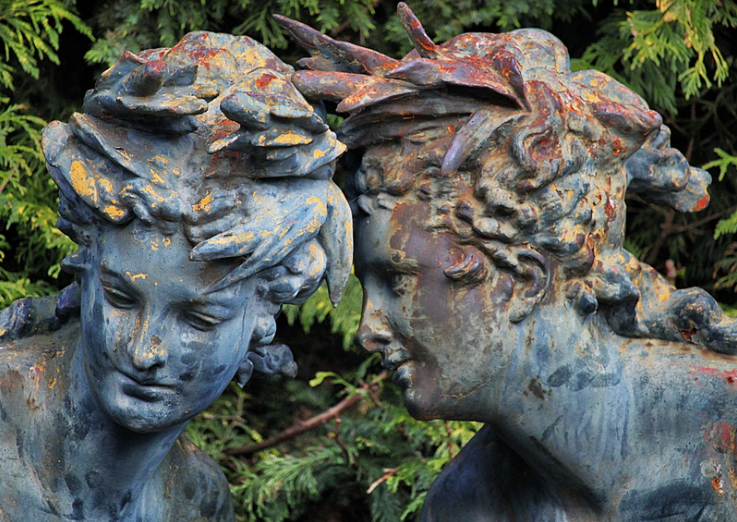 Statue whispering in another statue's ear