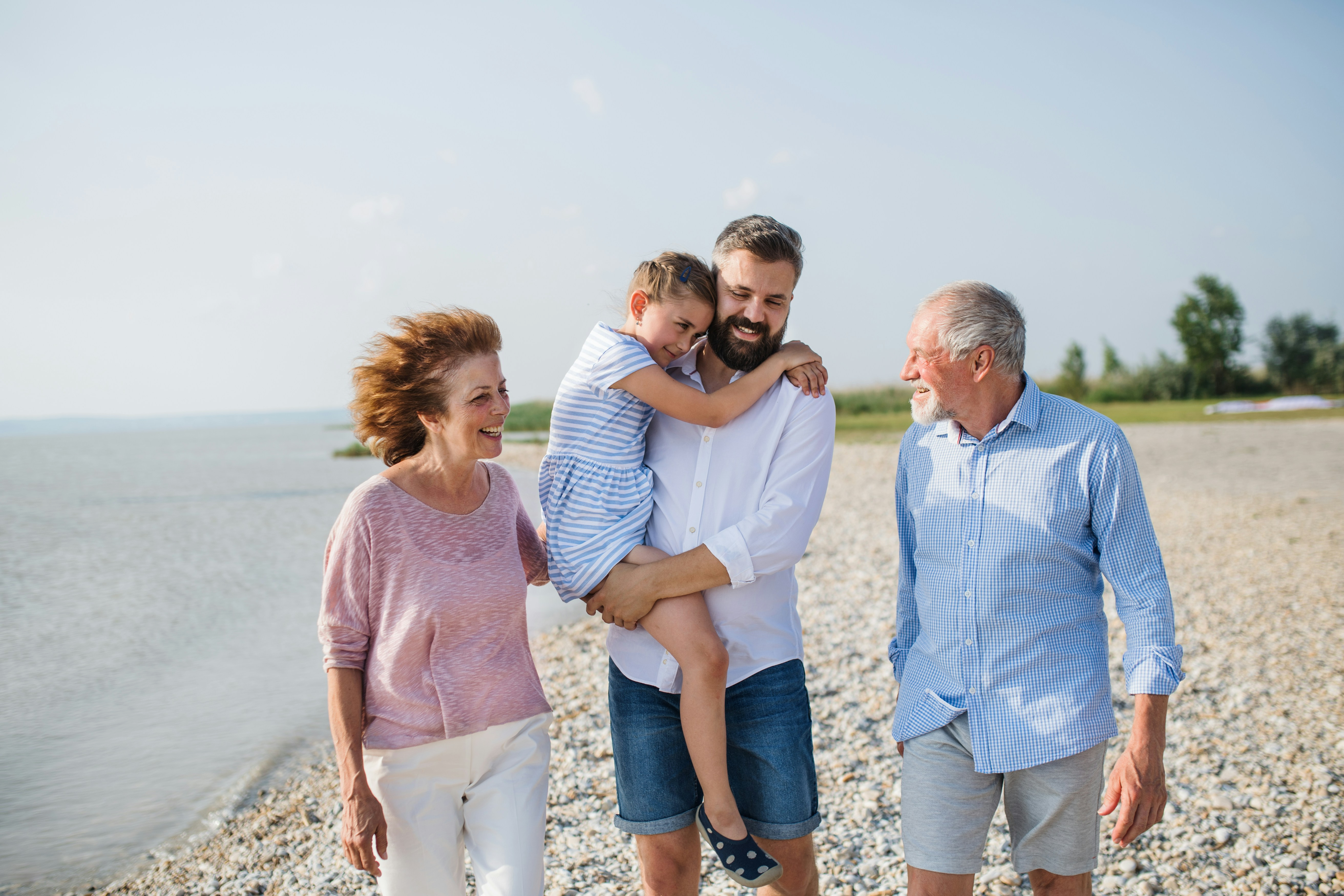 family walking on a beach