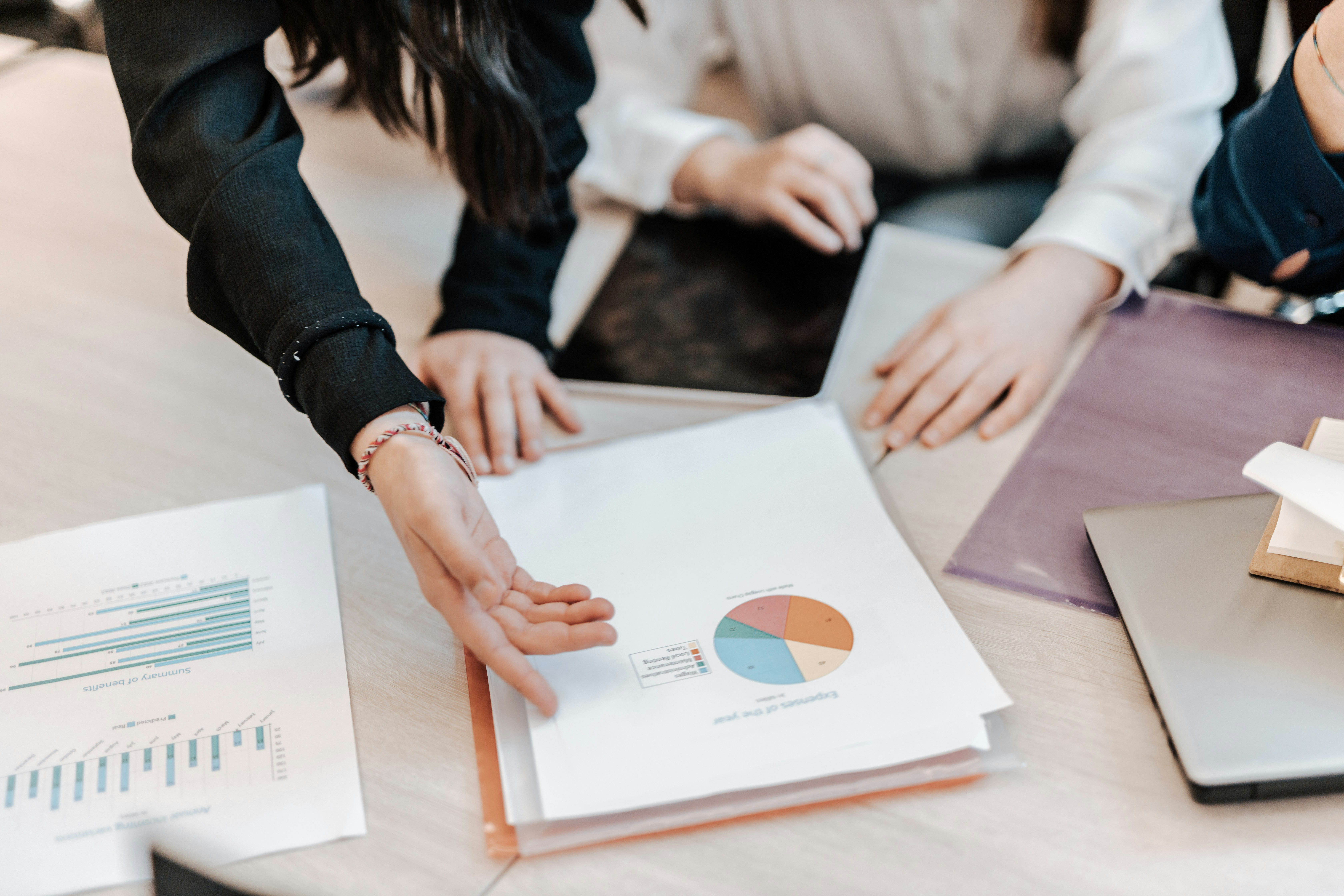 professionals reviewing data sheets