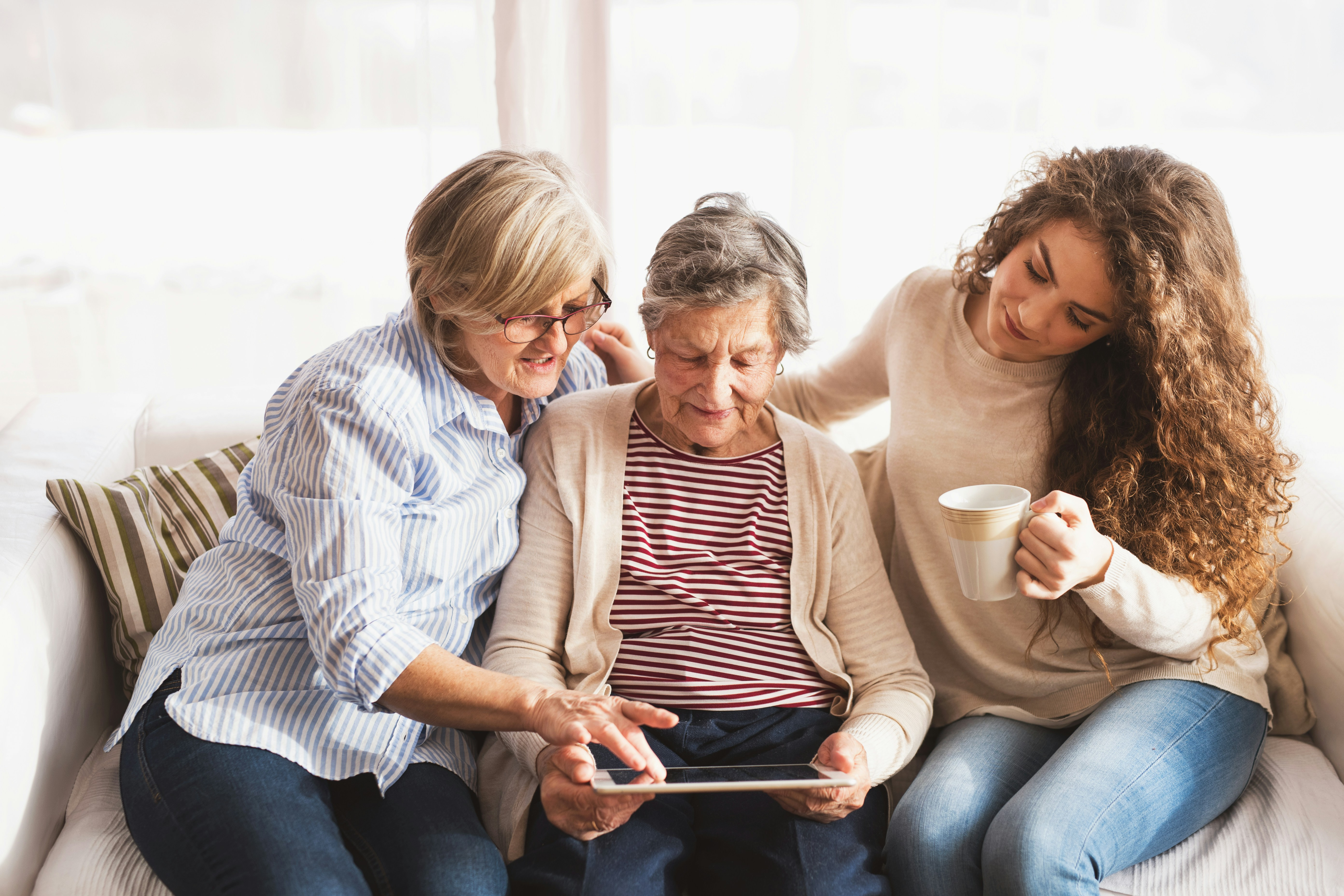 family members looking at a laptop