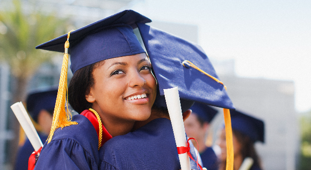 hug shared between two young graduates