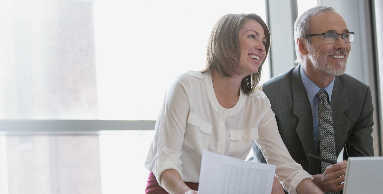 business man and woman working on computer