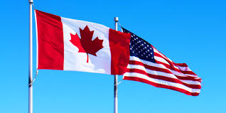 US and Canada Flag waving in the wind