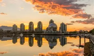 Vancouver sunset by water and city as backdrop