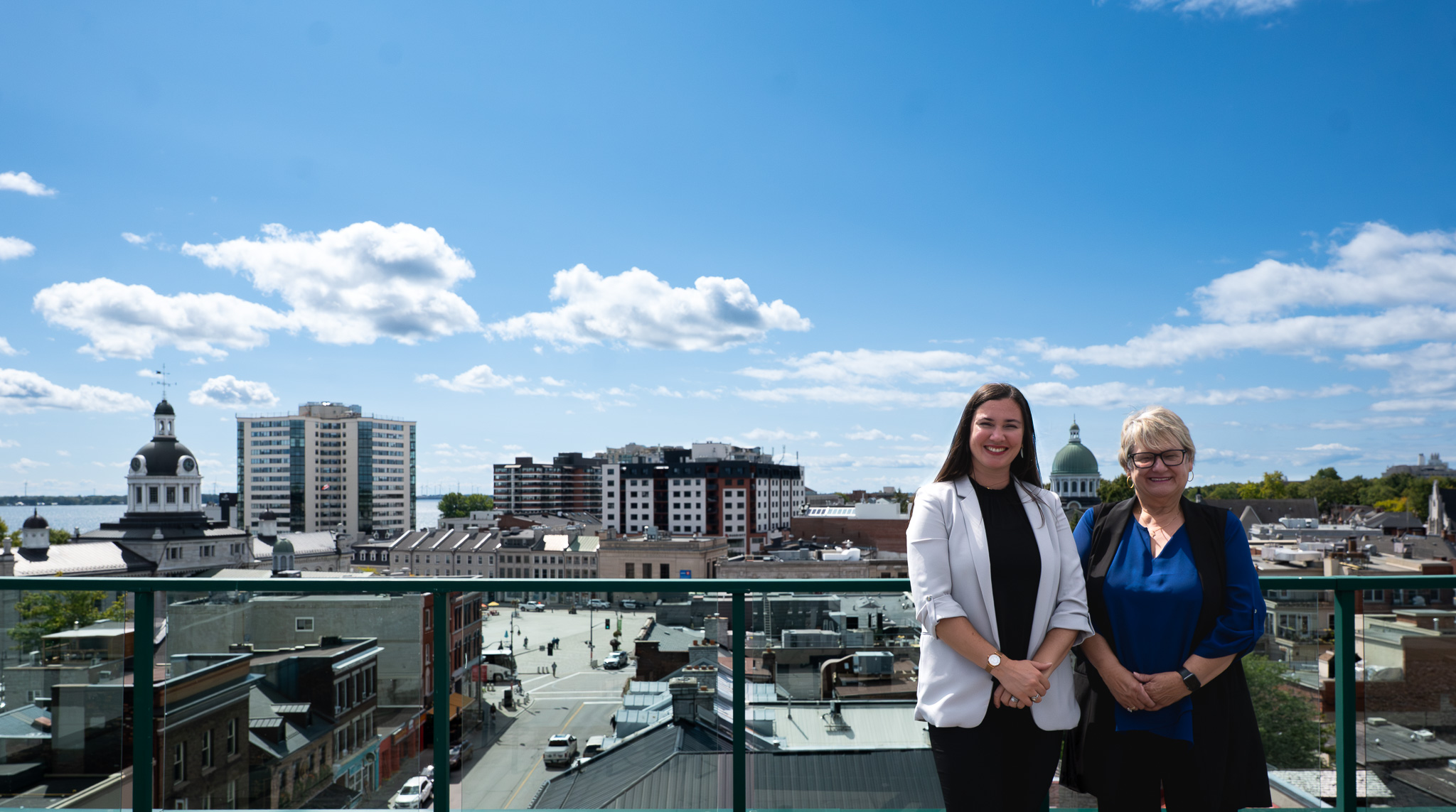 Joanne and Lisa in front of the Kingston skyline