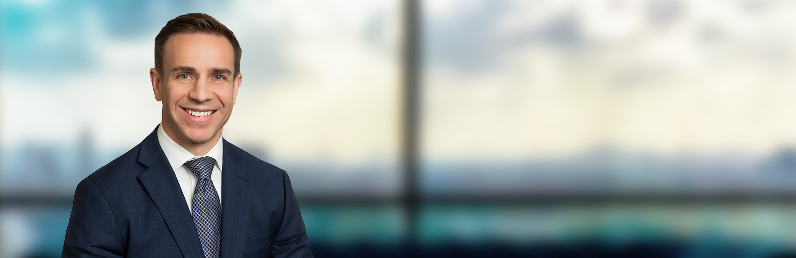 Patrick in front of Office window 