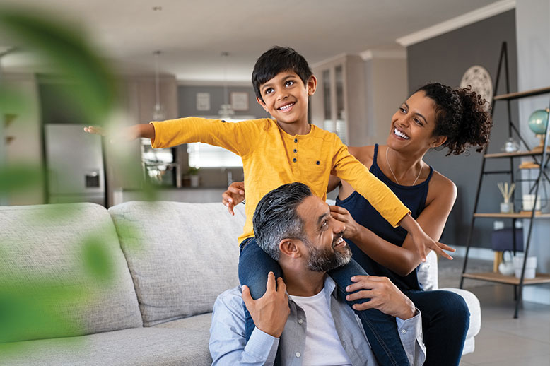 interracial couple with their son at home