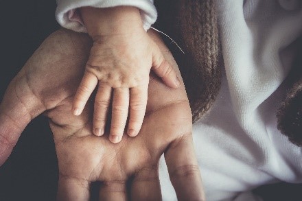 child hand on an adult hand