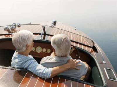 Seniors couple in a boat on the water