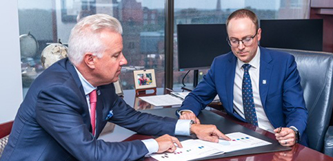 People sitting around boardroom table