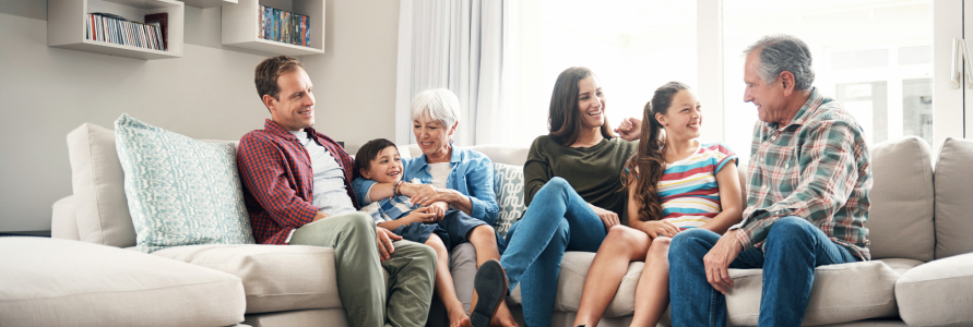 Multi-generational family sitting on couch