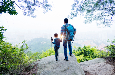Man and son at the lookout of a hike