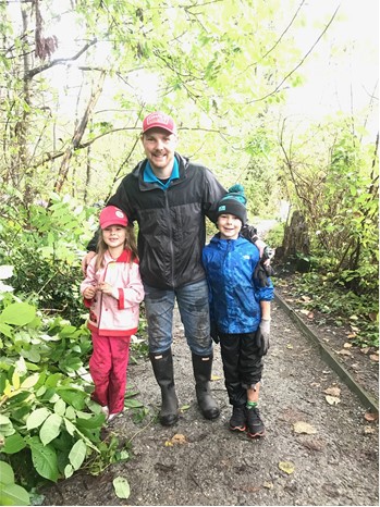 Ryan and family helping remove invasive plants from Rocky Point Park in Port Moody