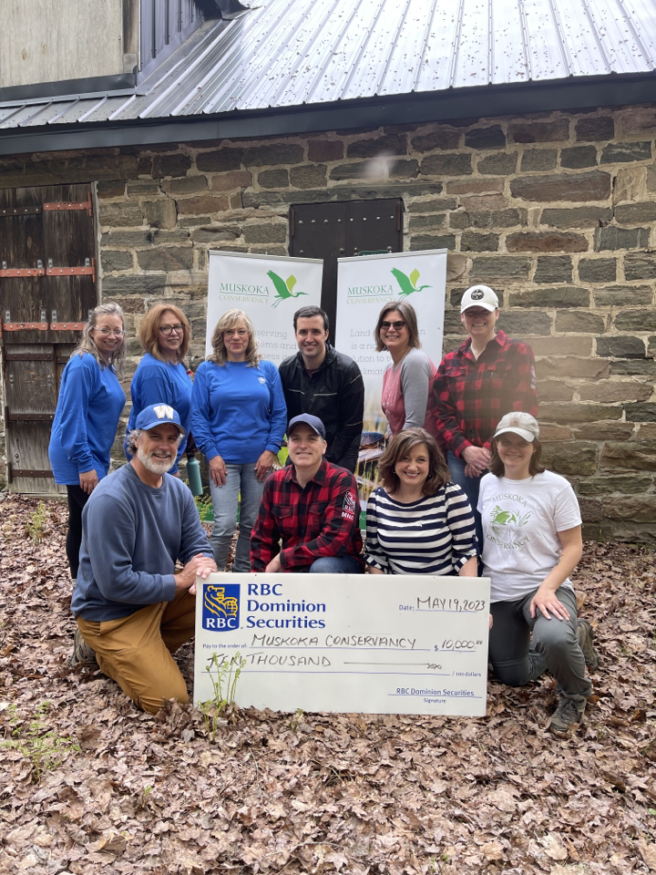 Volunteering to help create a new trail at Muskoka Conservancy's UpJohn Nature Reserve