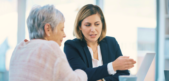 A portfolio manager assisting her client.