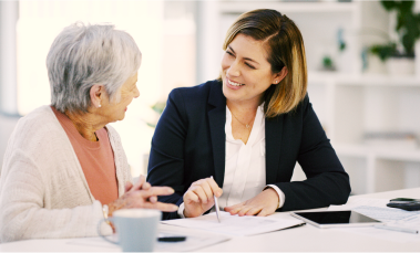 An investment advisor working with her elderly client.