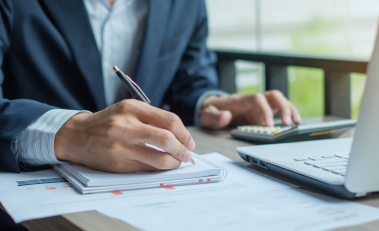 Close-up of a business owner reviewing documents.