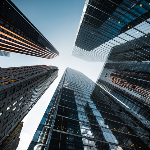 A bottom-up view of skyscrapers.