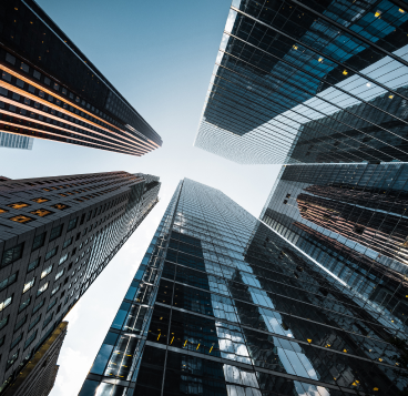 A bottom-up view of skyscrapers.