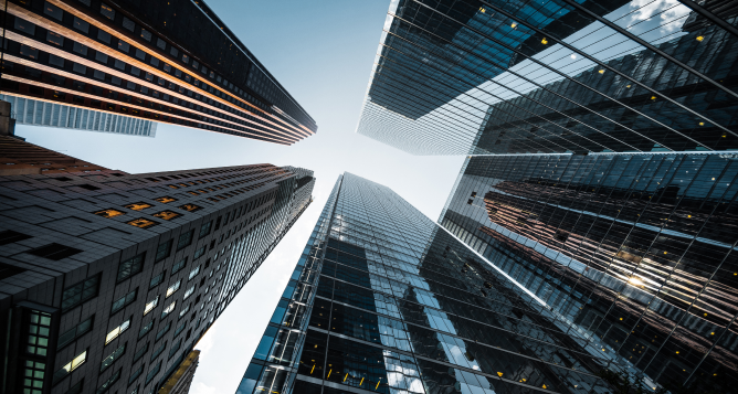 A bottom-up view of skyscrapers.