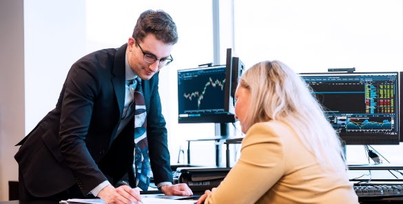 Two members of the Rae Family Wealth team collaborating in an office.