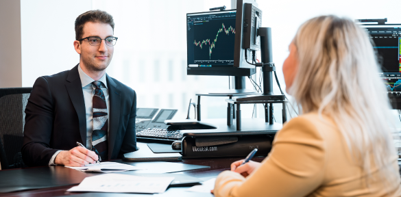 Two members of the Rae Family Wealth team in an office.