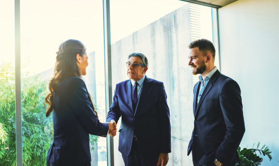 A group of people shaking hands.