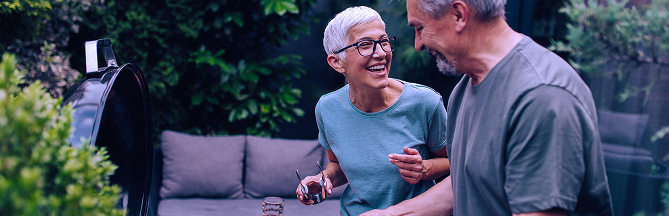 A retired couple outside.