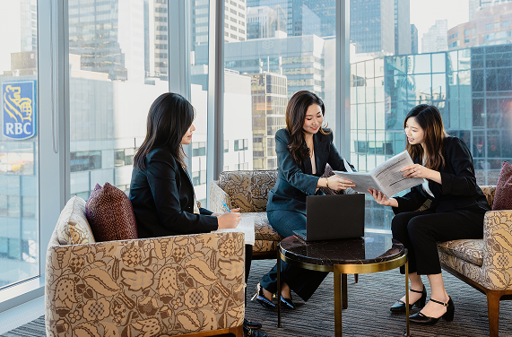 magnifying glass laying on documents with data visualizations