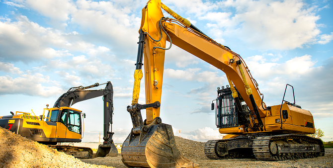 Two excavators on a construction site.