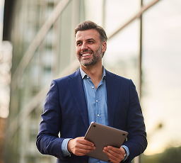 A business owner walking with their iPad.