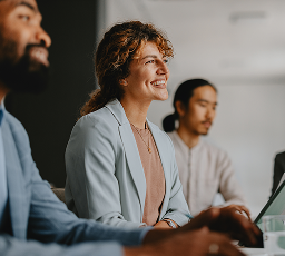 Professionals at a board room table.