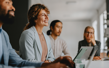 Professionals at a board room table.