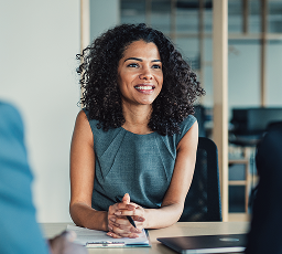 A woman meeting with her clients.